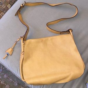 Dooney & Bourke Light Tan Crossbody Bag with unique stitching trim.